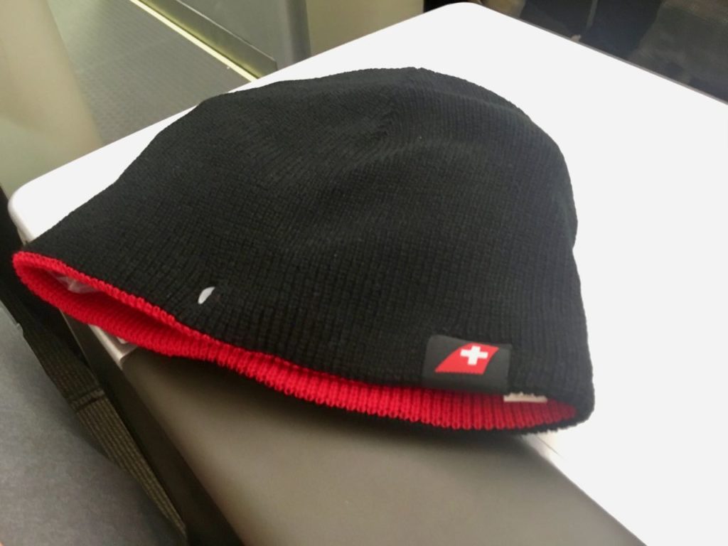 a black and red beanie on a table