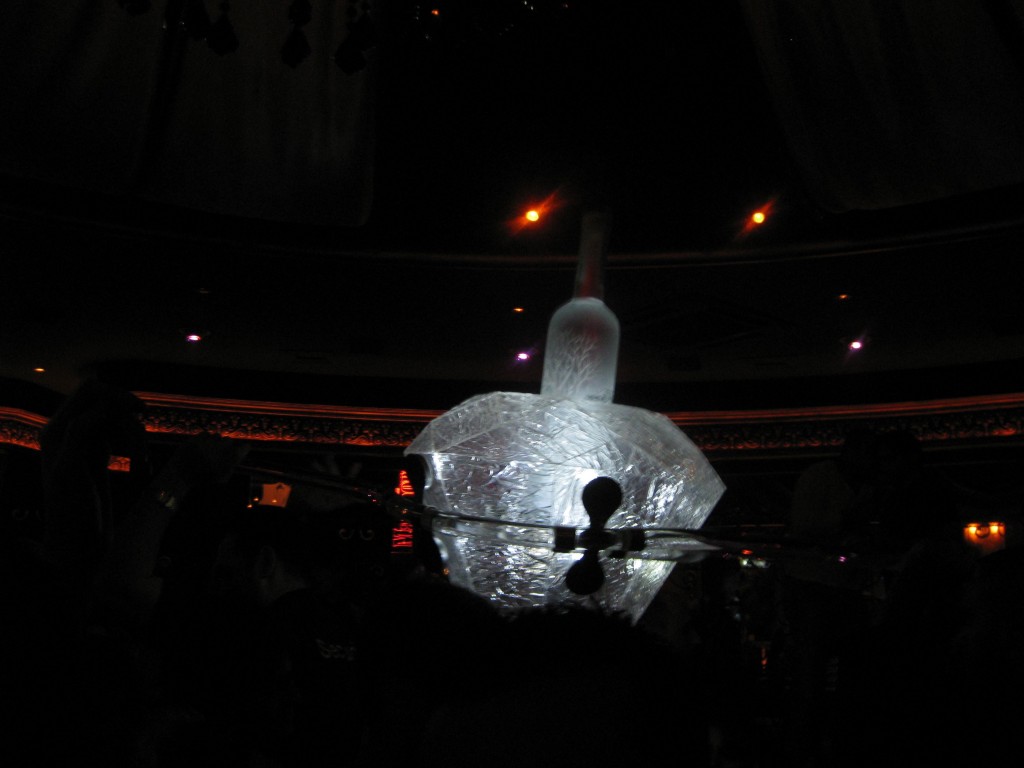 a crystal object in a dark room