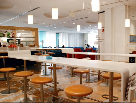 long white tables and stools in a restaurant