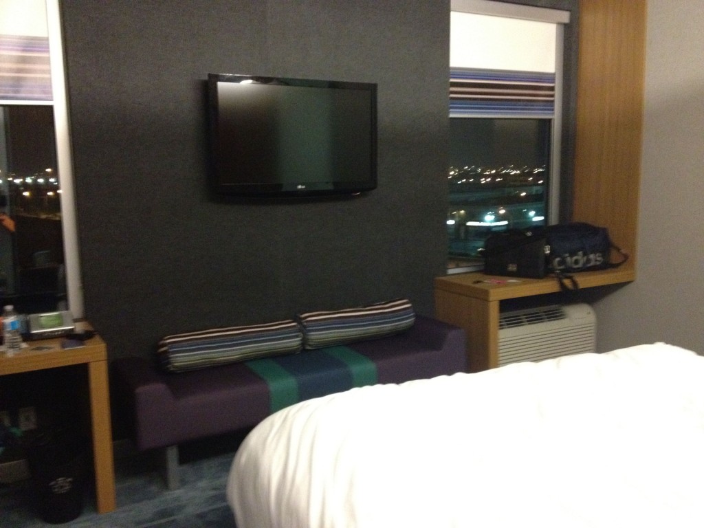 a tv on the wall in a hotel room