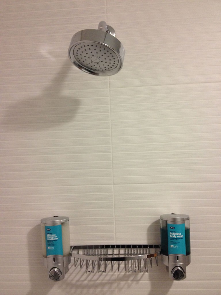 a shower head and soap dispensers