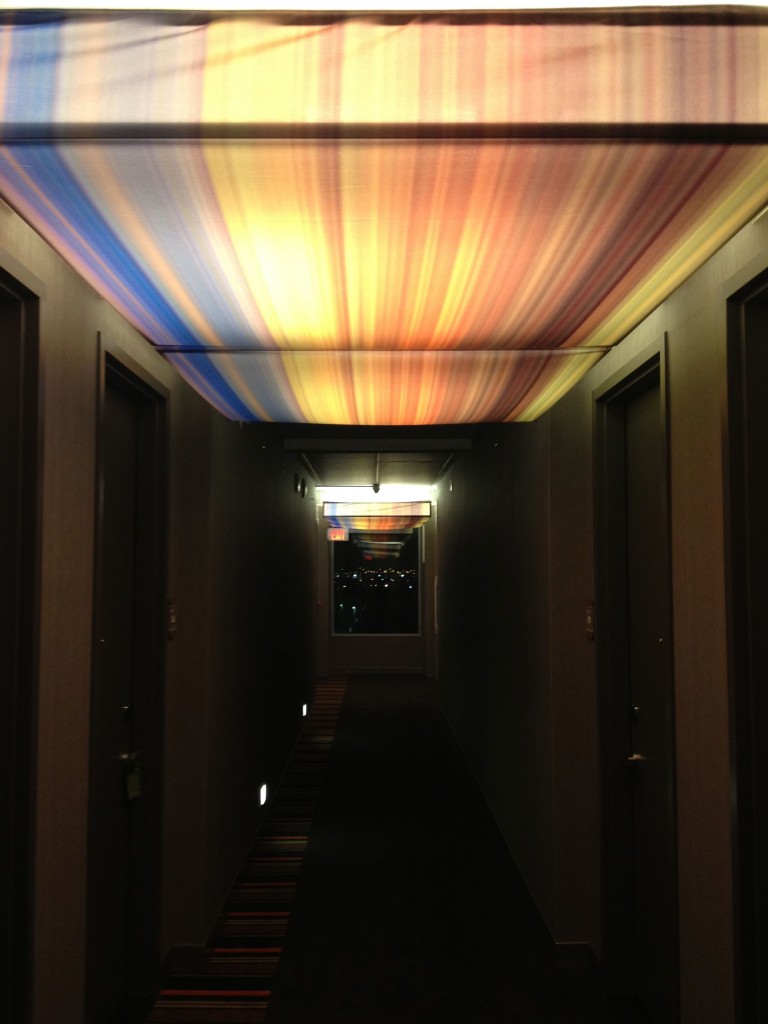 a hallway with multicolored ceiling