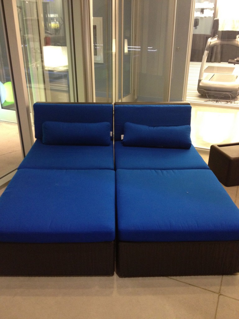 a blue couch with pillows