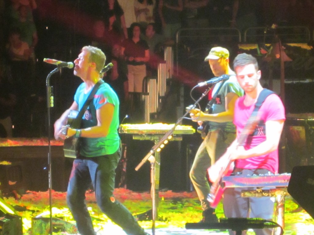 a group of men playing instruments on a stage