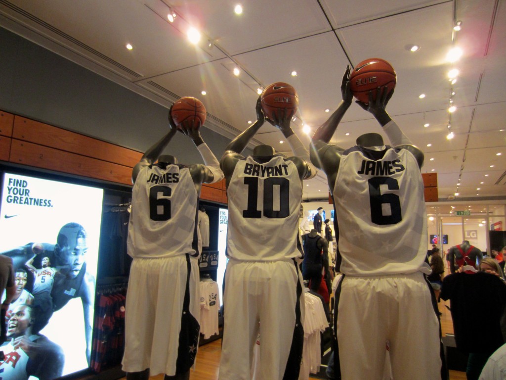 a group of mannequins holding basketballs