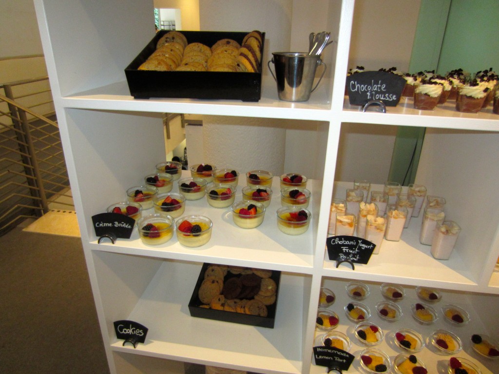 a shelf with desserts and cookies