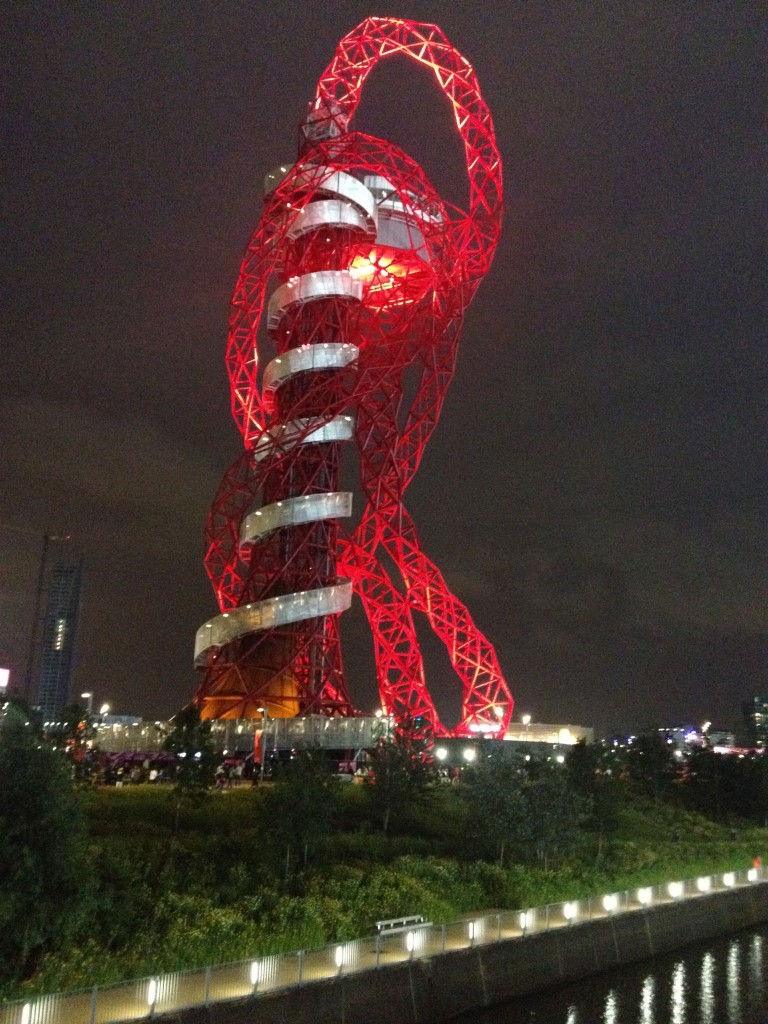 a red and white sculpture at night