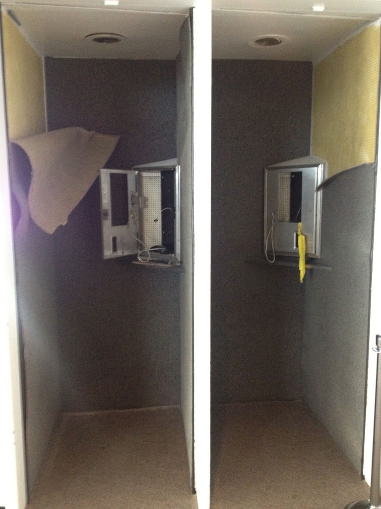 a two doors with a screen and a telephone
