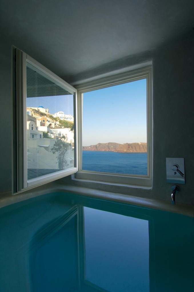 a pool with a window overlooking the water