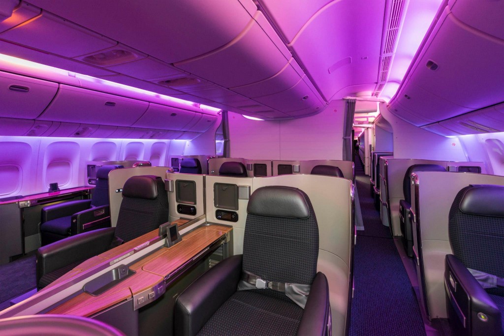 a inside of an airplane with purple lights