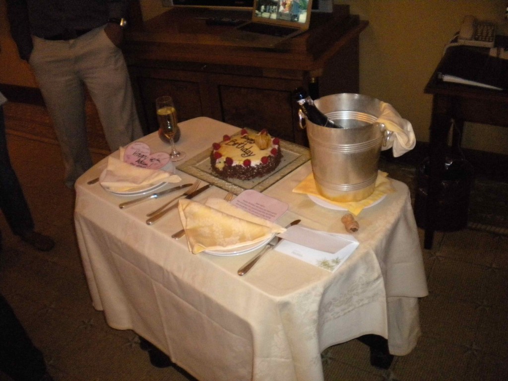 a table with a cake and utensils