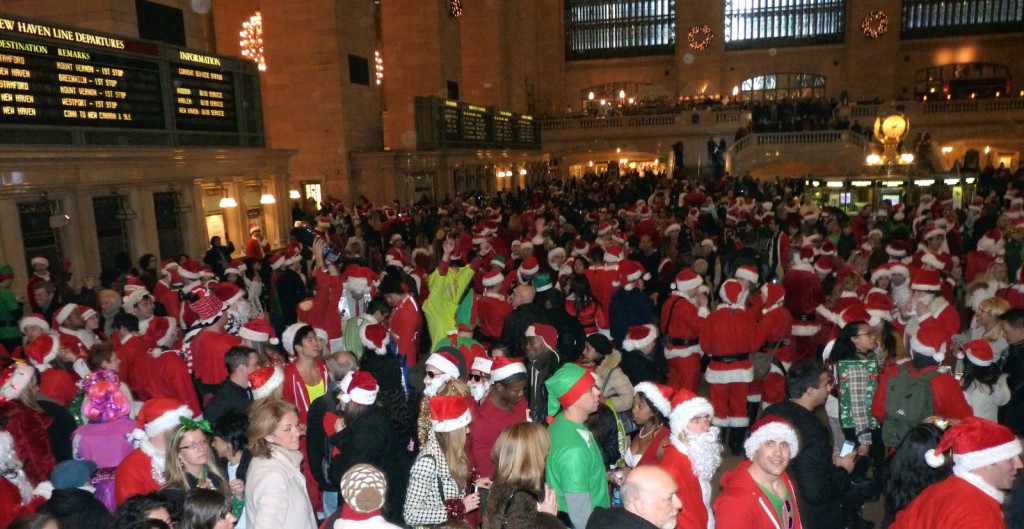 a large crowd of people in santa clothing