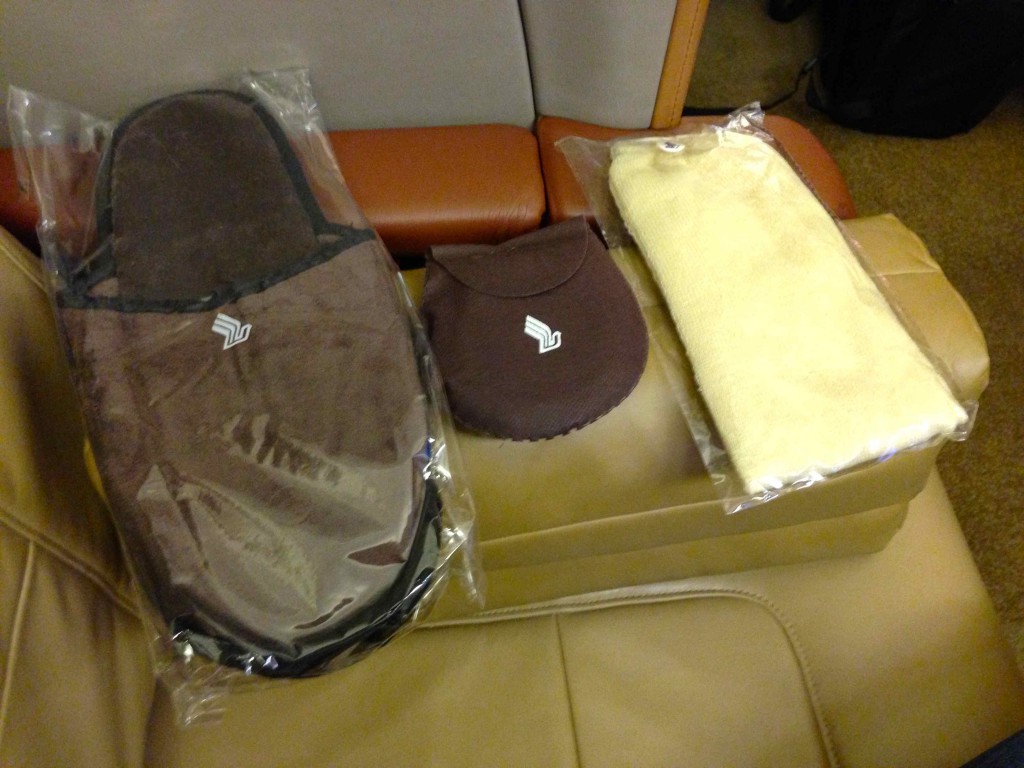 a pair of slippers and a towel on a seat