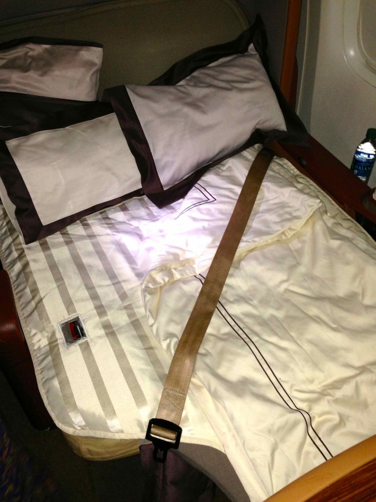 a bed with a seat belt