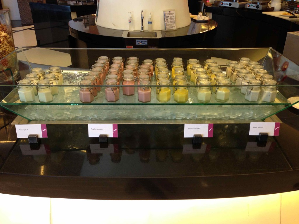 a group of jars of different colors on a counter