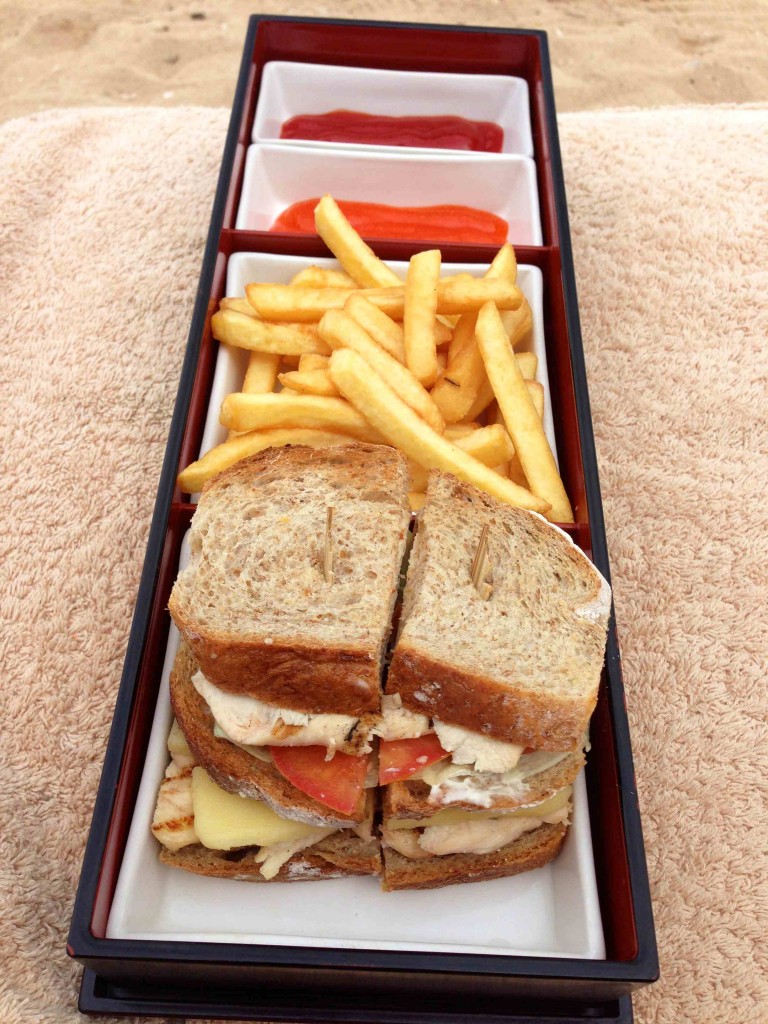 a sandwich and fries in a tray