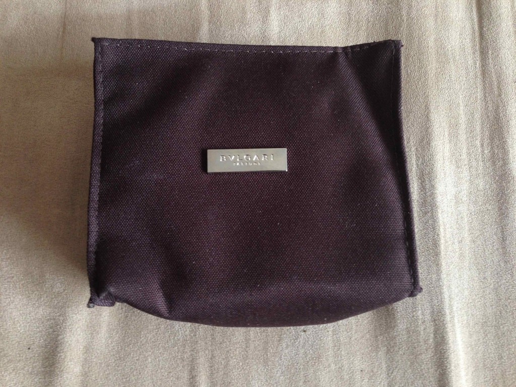 a small black bag on a white surface