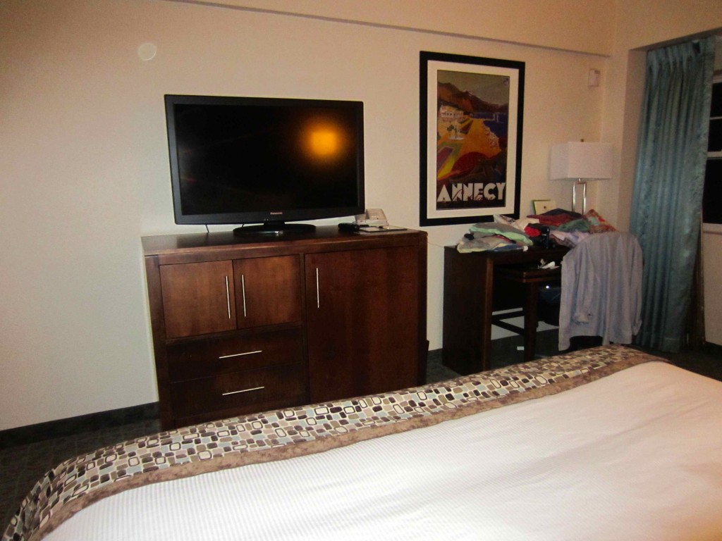 a tv on a cabinet in a hotel room
