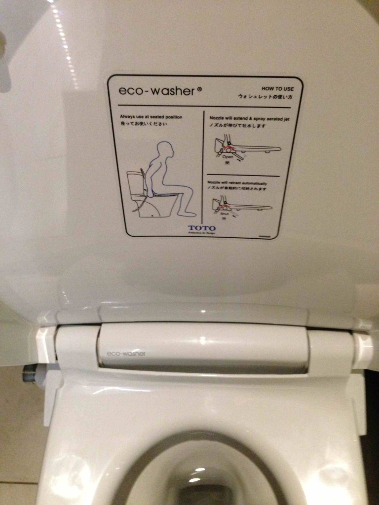a sign on a toilet