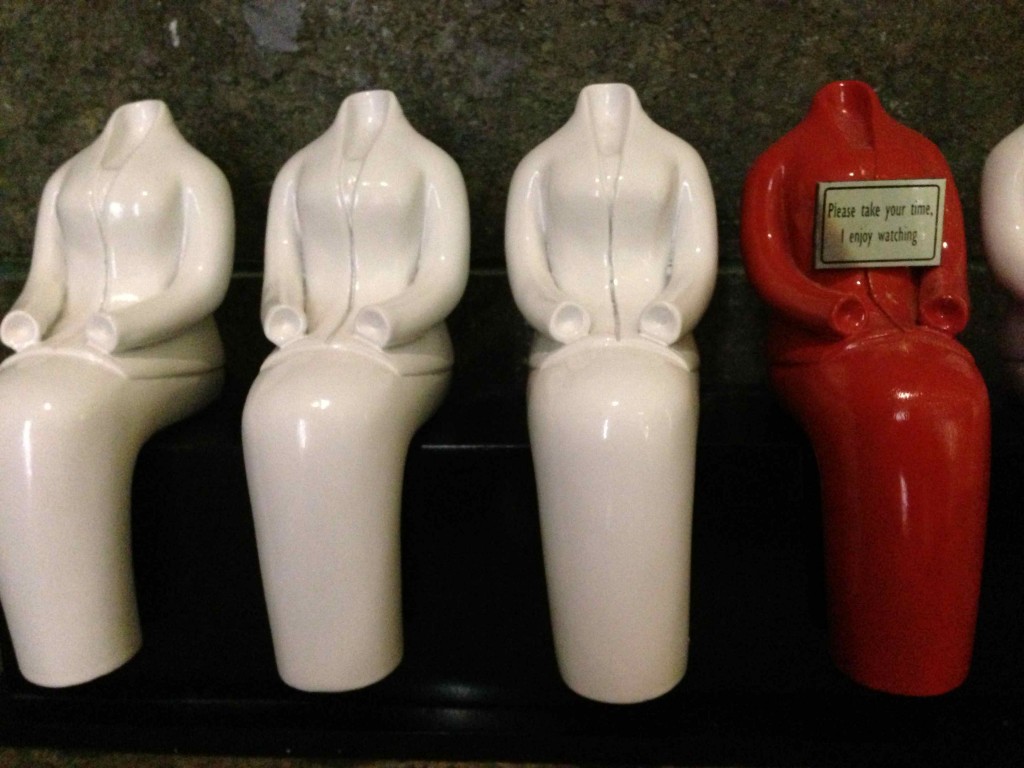 a group of white and red statues