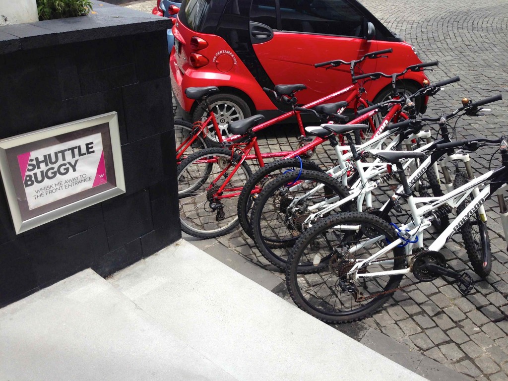 a group of bicycles parked on a brick road