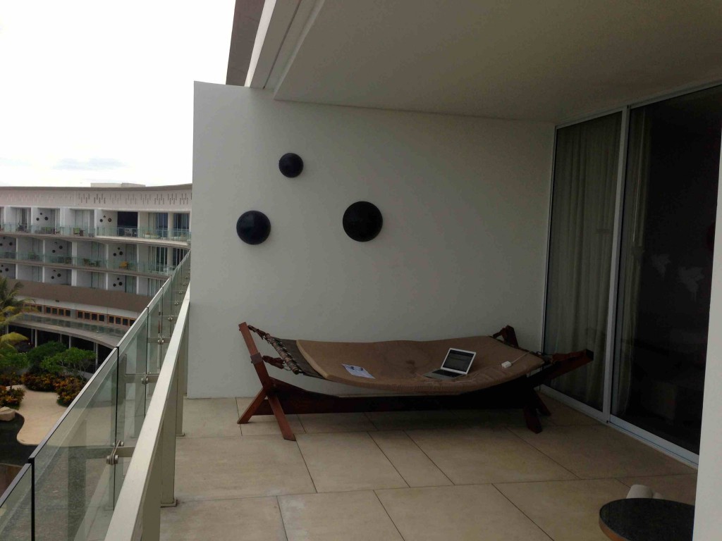 a hammock on a balcony