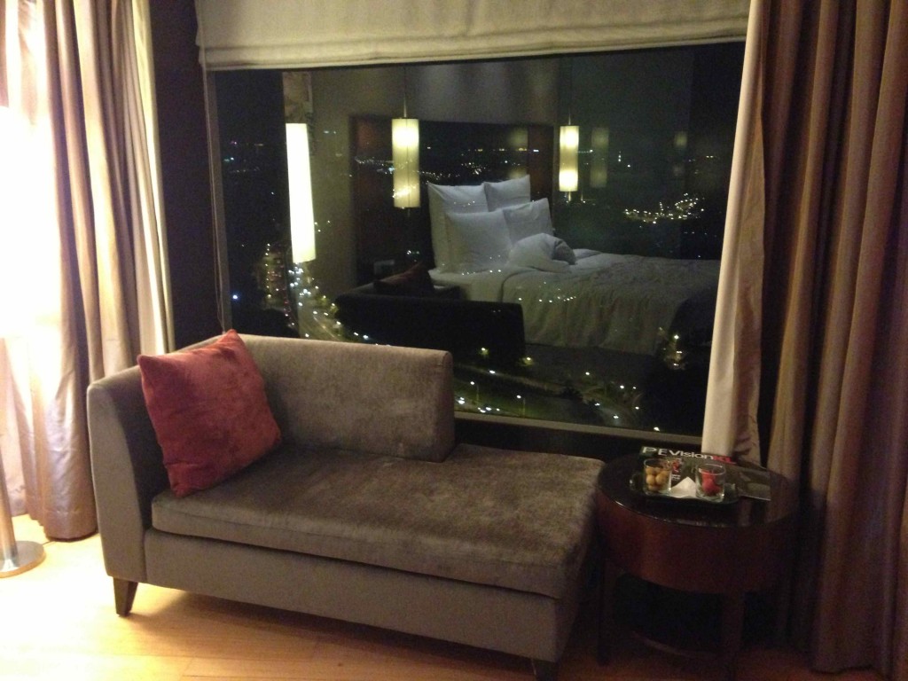 a couch and a table in front of a window