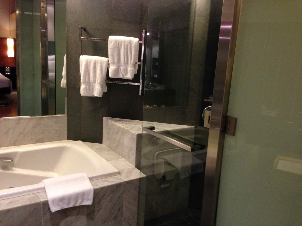 a bathroom with a bathtub and towels