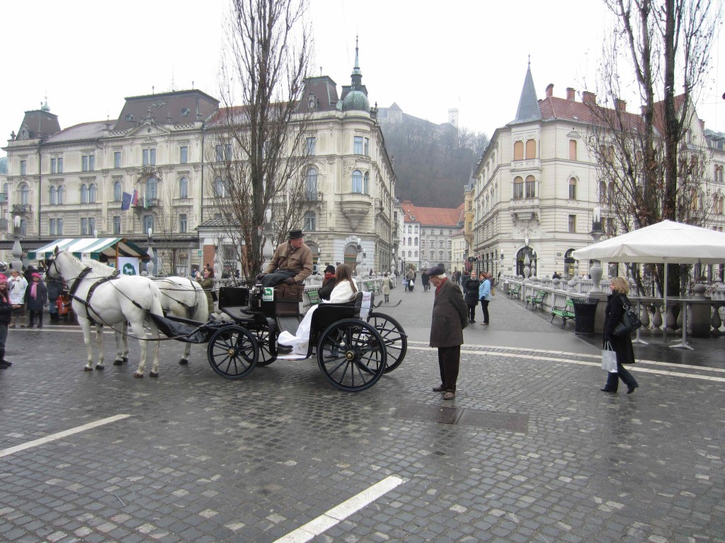 a horse carriage with people in it
