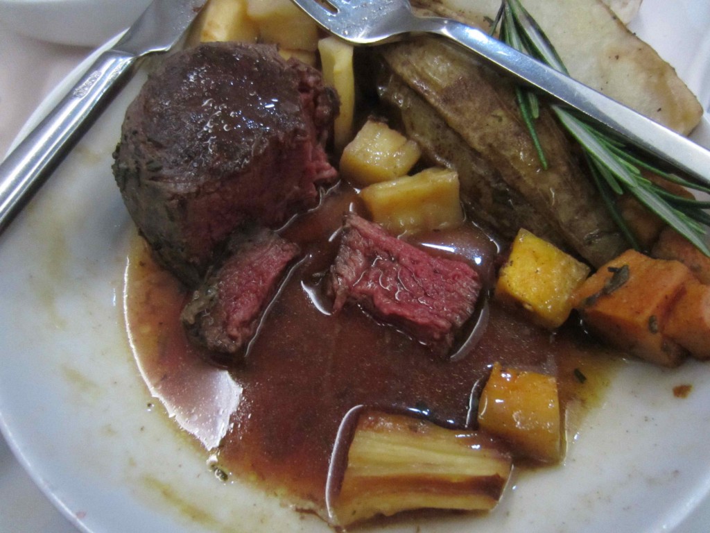 a plate of meat and vegetables