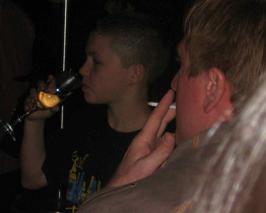 a man drinking a cigarette