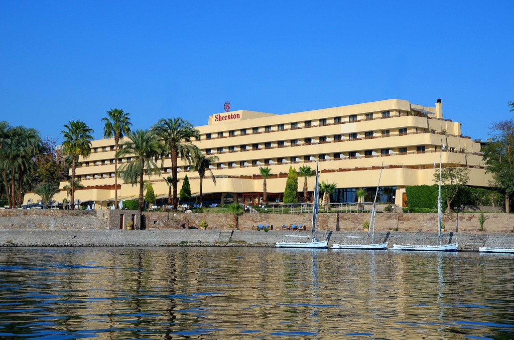 a building with many windows and a body of water