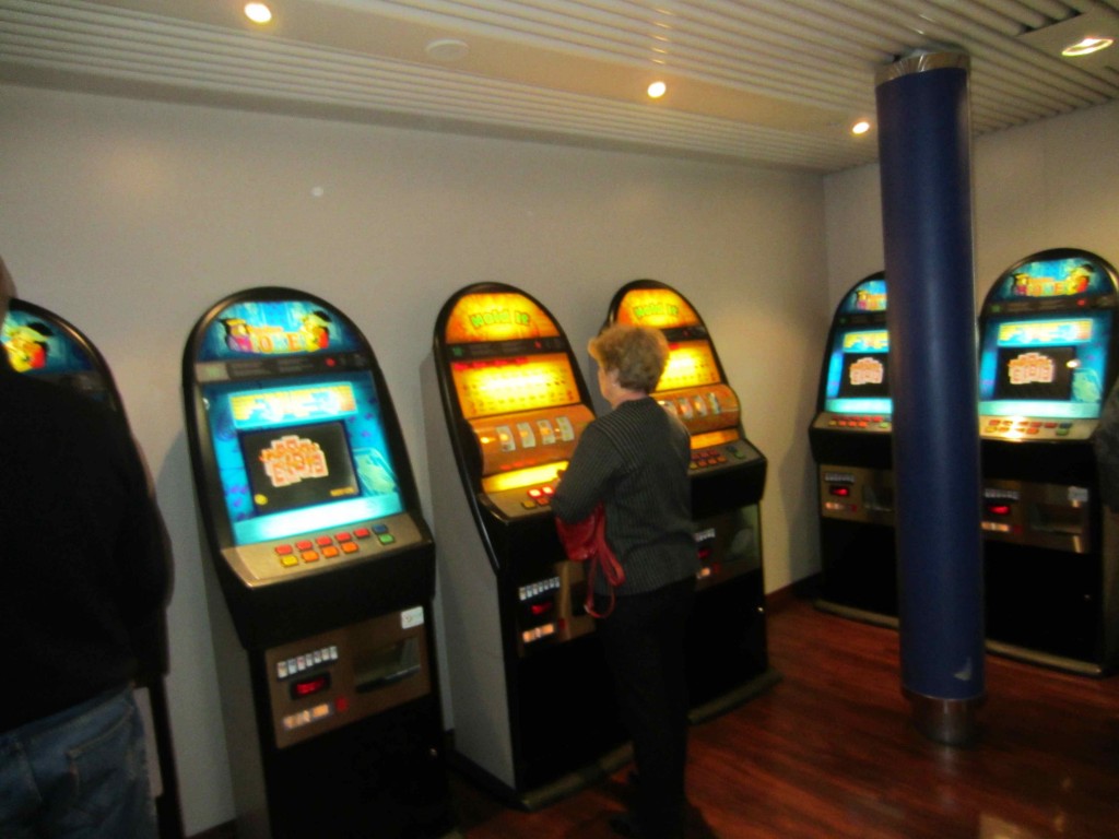a woman playing slot machines
