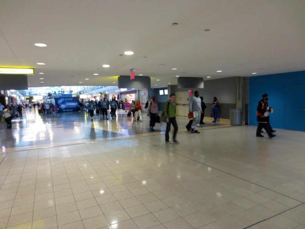 a group of people walking in a large hall