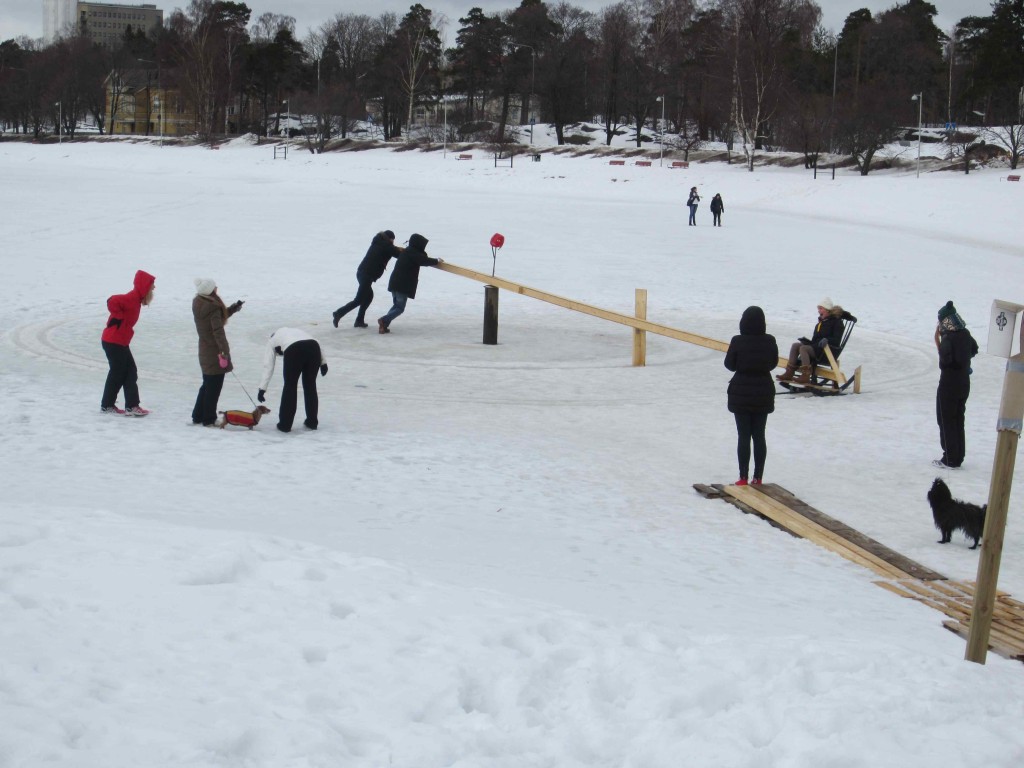 a group of people playing in the snow