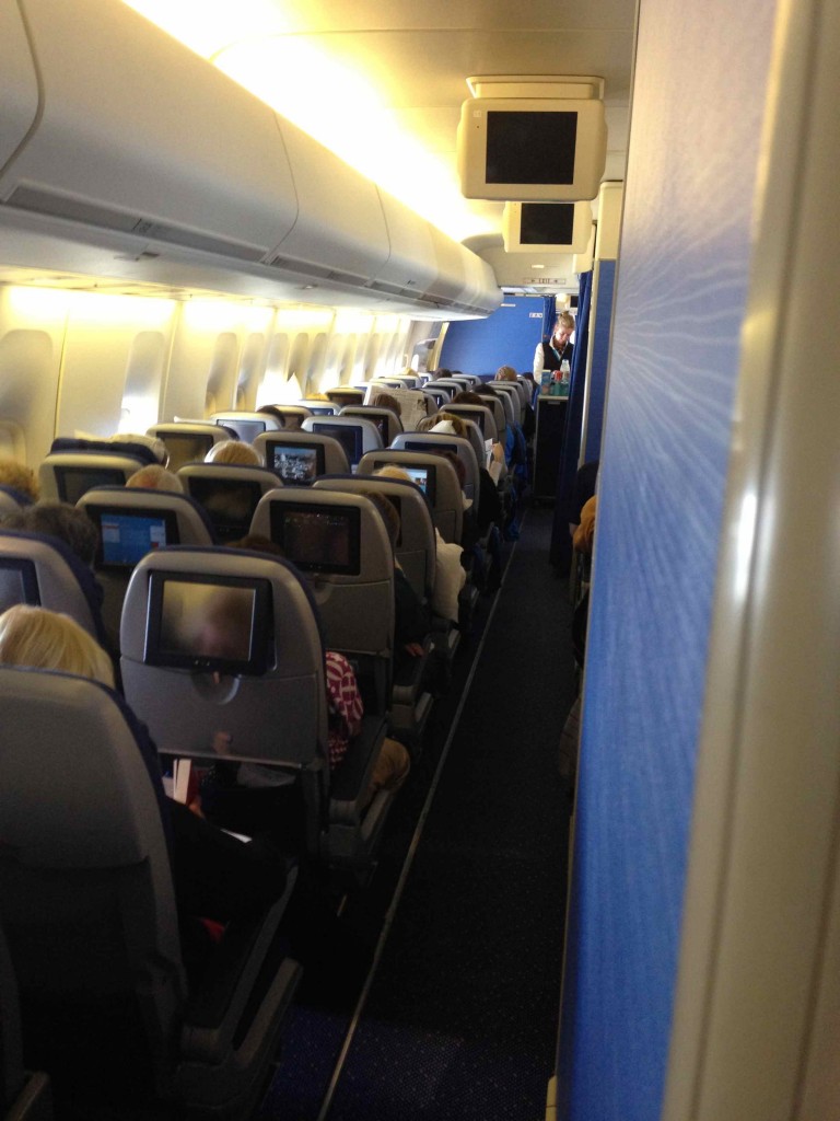 a plane with seats and people sitting on it