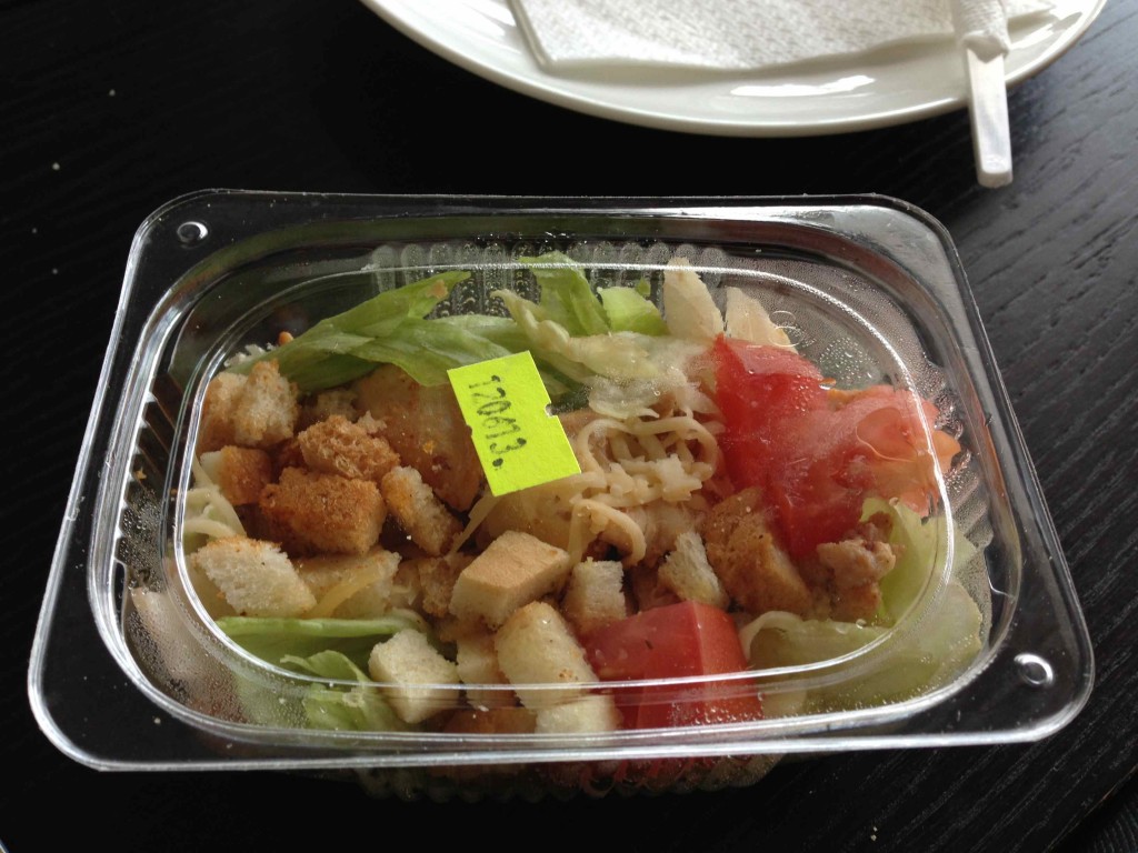 a salad in a plastic container