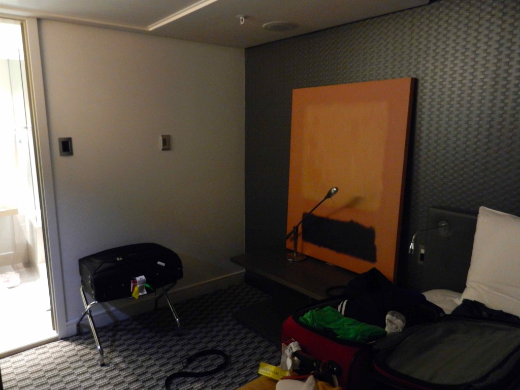 a room with a microphone and luggage