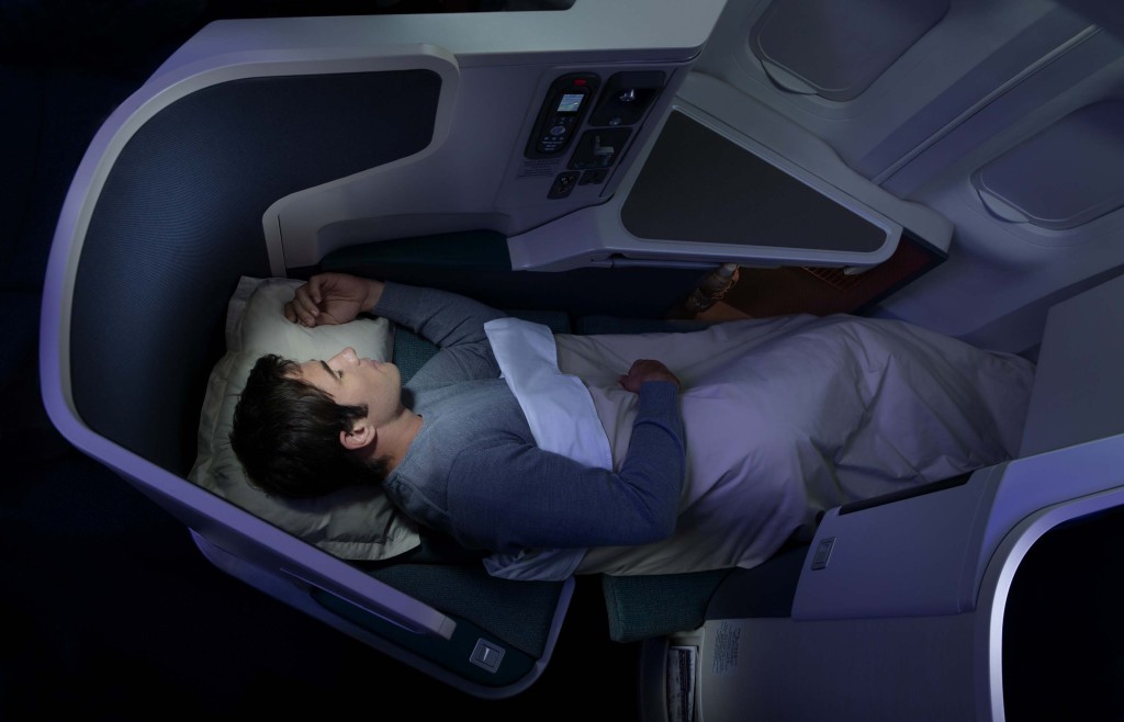 a man lying in a plane