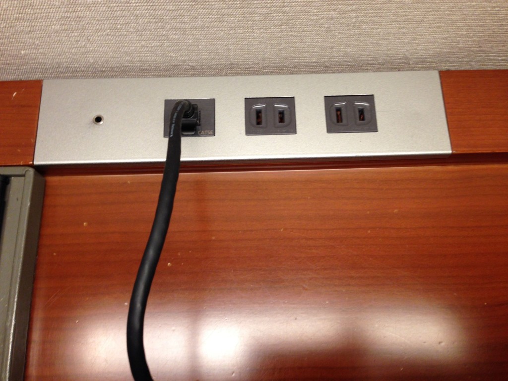a black cord plugged into a wall