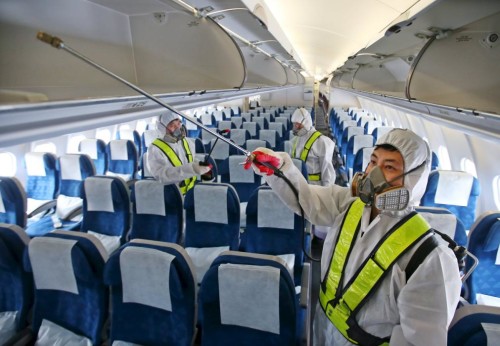 a group of people wearing protective gear and masks