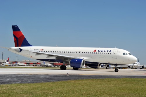 a delta airplane on the runway