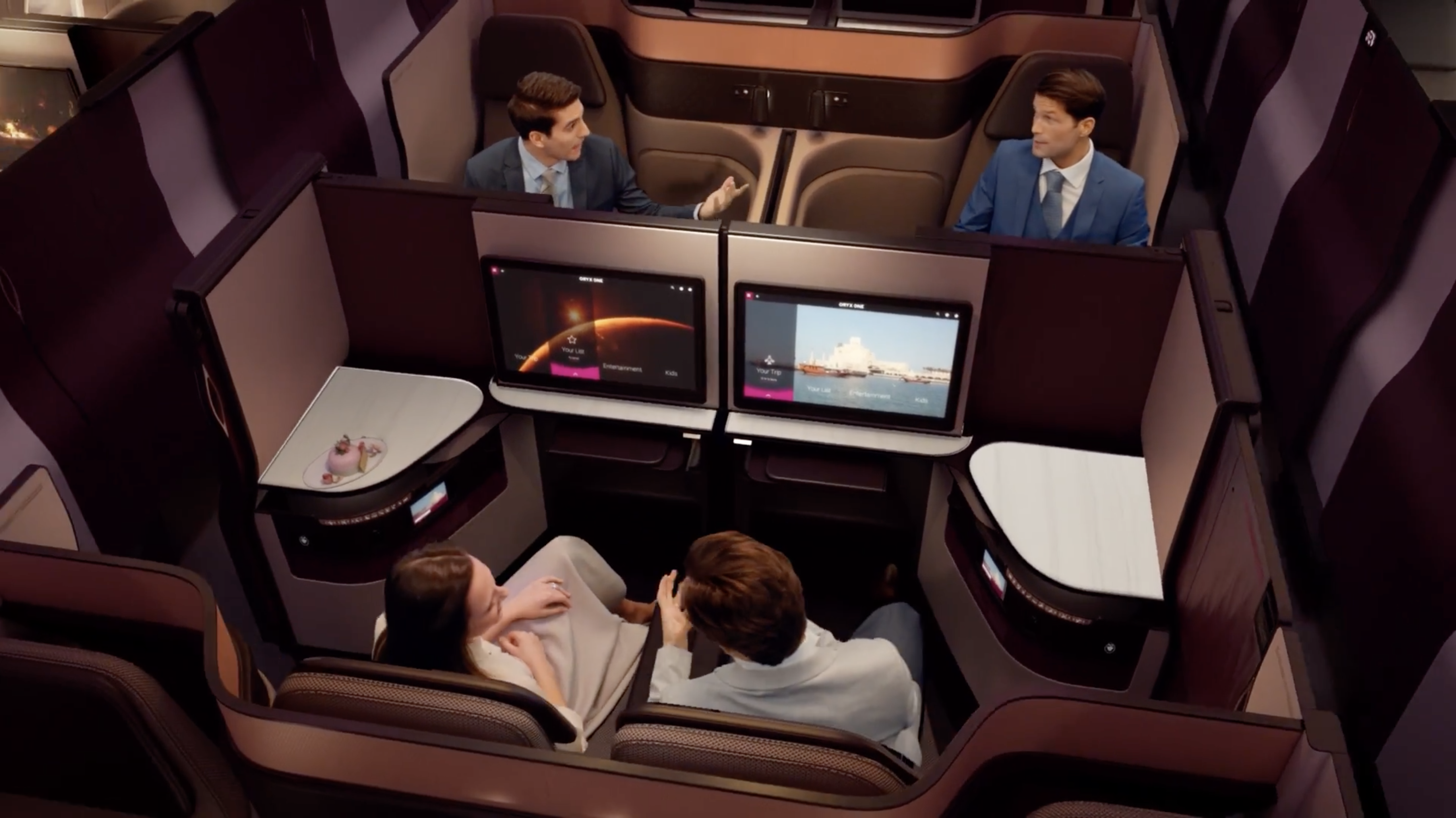 a group of people sitting in chairs in a business class
