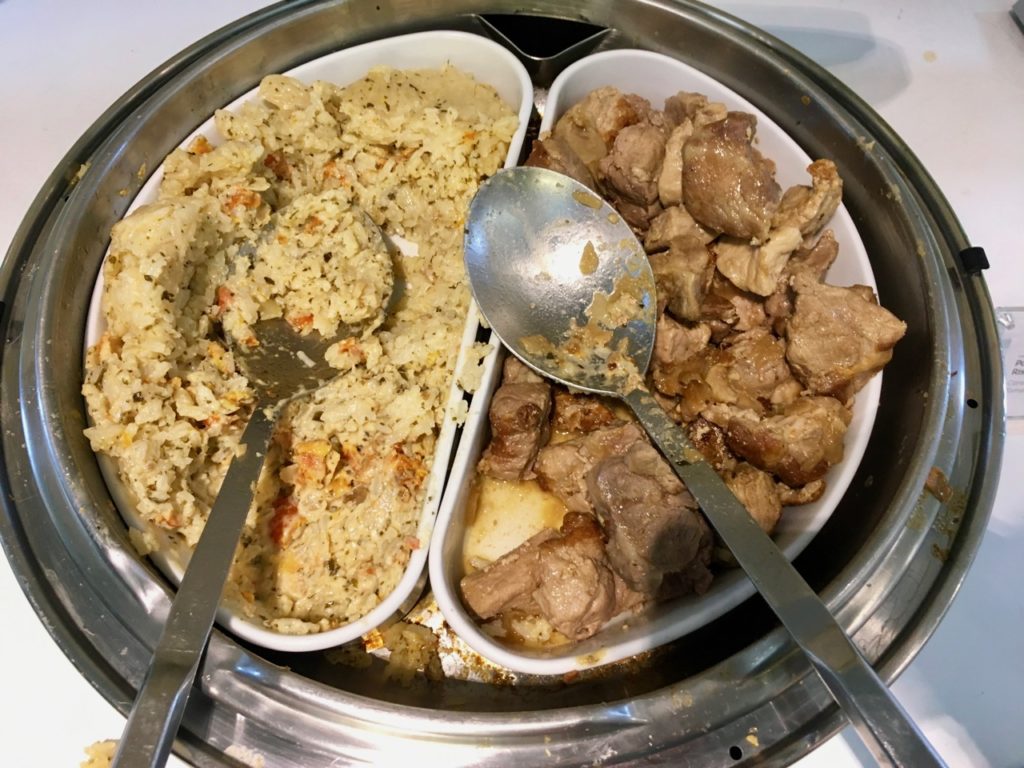 a tray of food with spoons