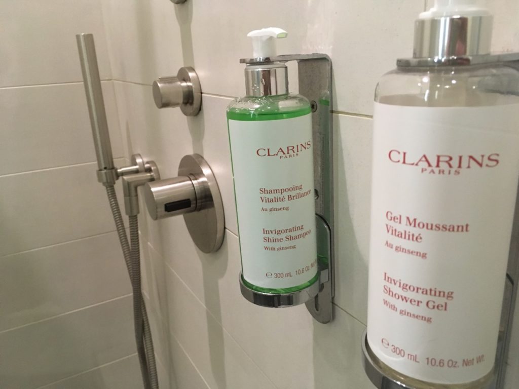 a shower gel and shampoo bottles