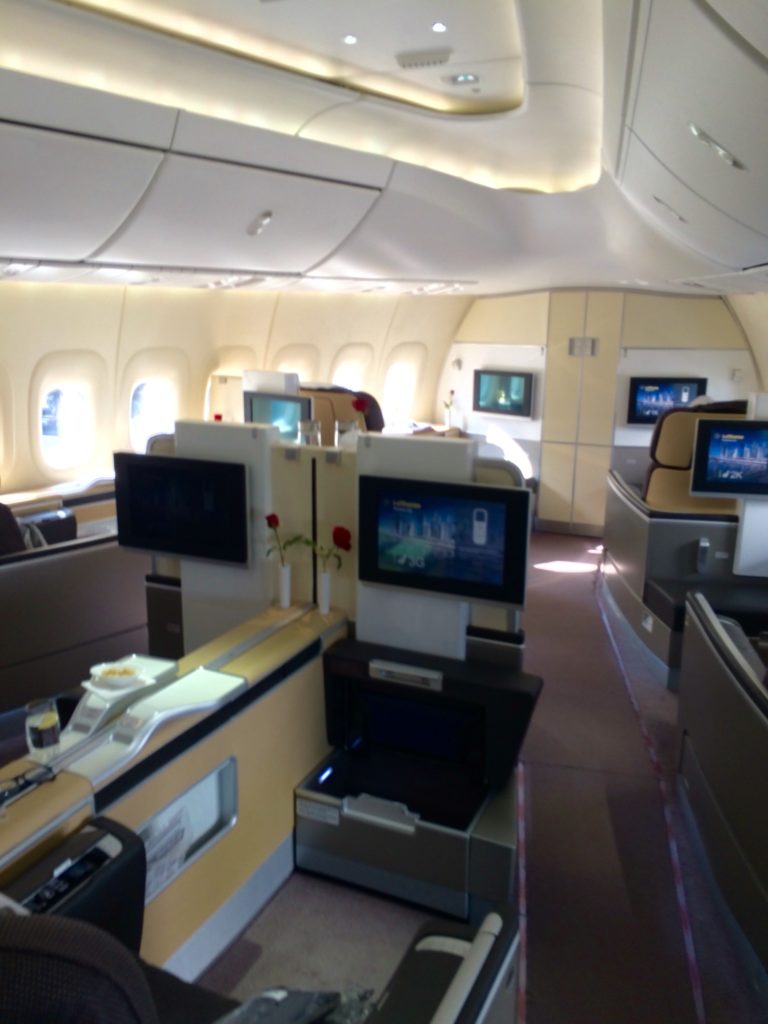 a plane with a few seats and a television