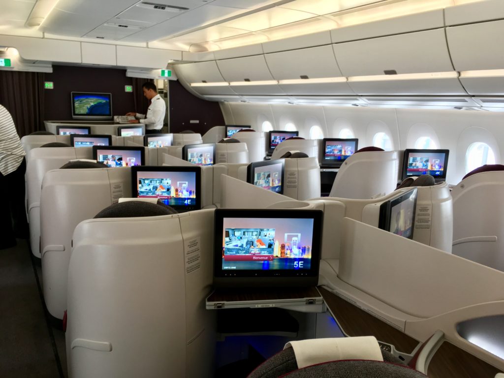 a row of computers on an airplane