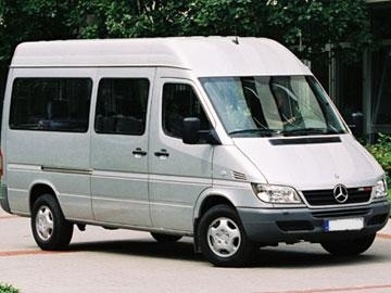 a silver van parked on the side of the road