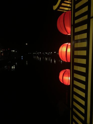 a red lanterns on a wall