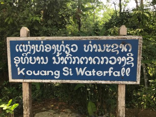 a blue sign with white writing on it